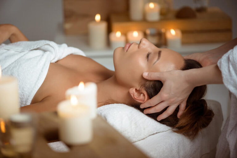 young-woman-having-face-massage-relaxing-spa-salon.jpg